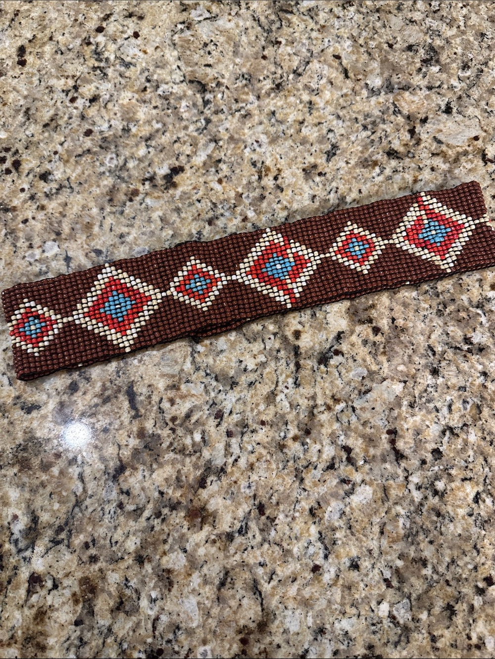 Handmade Brown Beaded Bracelet with Red and Turquoise Geometric Pattern